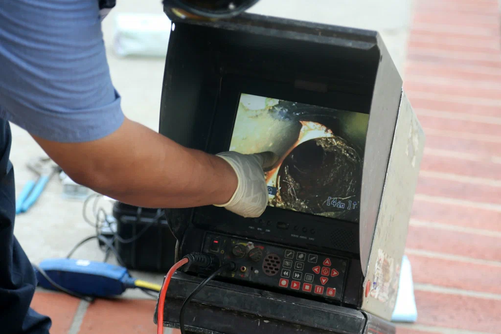Technician viewing a drain inspection camera in Salinas
